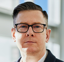 暗号資産取引会社の経営幹部であるAlexander Hughes CEOの肖像写真